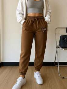 jogger mujer  pants deportivos dama conjunto deportivo gris  pantalón con puño en el tobillo ropa cómoda para gimnasio  outfit casual femenino  look deportivo urbano - Camel - Ver 1