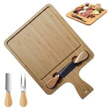 Tabla rectangular de bambú multiusos con utensilios para queso – ideal para carnes frías, frutas, panes y botanas. Fabricada con bambú natural de alta calidad, resistente y duradero, esta tabla de 27 x 23 cm y 1.2 cm de grosor incluye dos cuchillos de acero inoxidable con mangos de madera ergonómicos. Su diseño moderno con ranuras para colocar los utensilios facilita el uso y el almacenamiento, mientras que su superficie lisa y elegante es perfecta para cortar, servir y decorar. Ideal para crear tablas de charcutería, servir postres o presentar alimentos en reuniones y cenas familiares. Su tamaño compacto permite manipularla fácilmente y almacenarla sin ocupar mucho espacio. Un accesorio funcional, decorativo y ecológico que realza la presentación de tus alimentos y eleva tus momentos en casa o eventos especiales. - ma - Ver 10