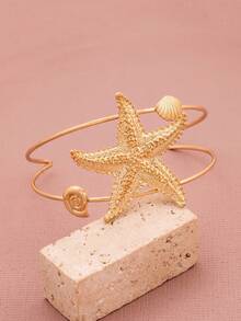 O coajă elegantă și la modă, cu strat dublu, în formă de stea de mare, cu deschidere reglabilă pentru brățară de damă