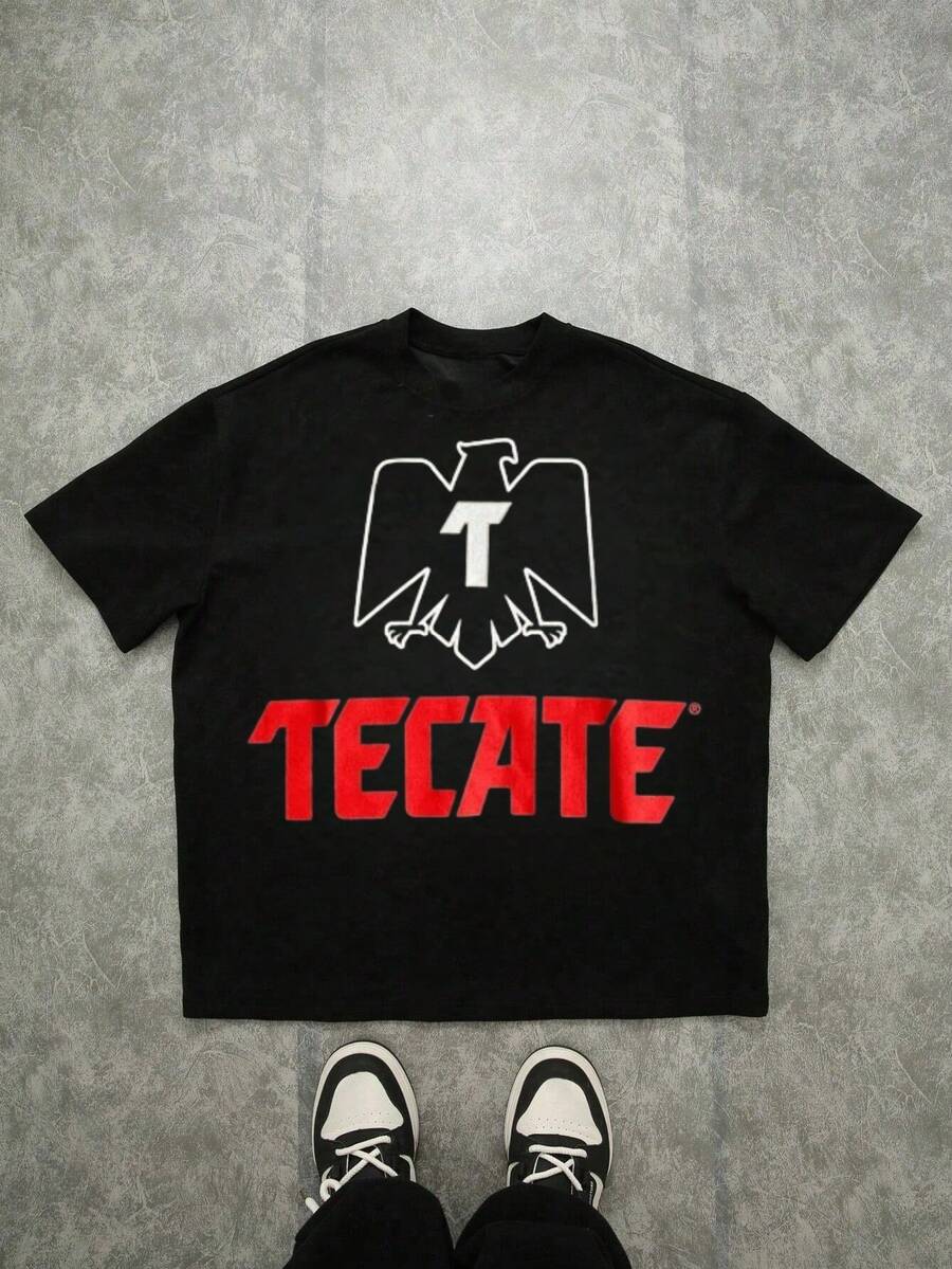 Camisa con estampa de logo TecateCómoda camiseta informal de manga corta.Cómoda camiseta informal de manga corta de algodón pesado de 220 gramos para hombre. Ropa navide?a. - Negro - Ver 1