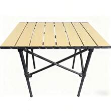 The Folding Camping Table Features A Roll-Up Surface, Comes With A Storage Bag, Has Adjustable Height, And Is Lightweight. It Is Suitable For Beaches, Picnics, Barbecues And Indoor Use.