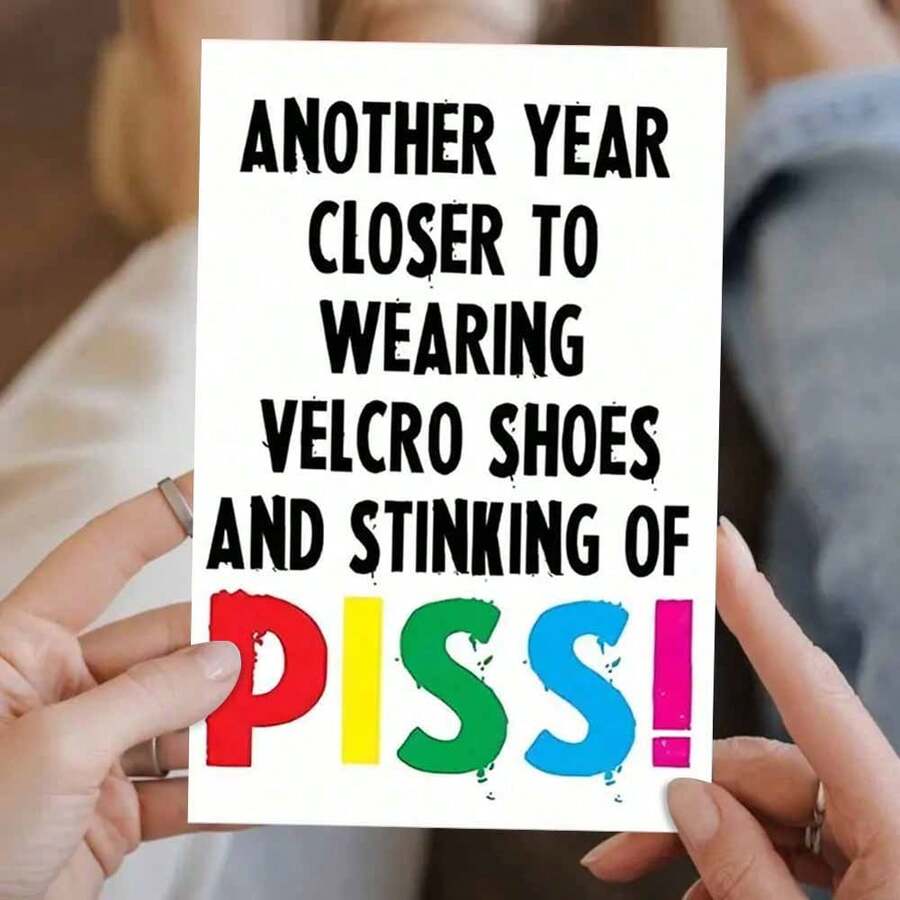 Edgy Humor Birthday Card With Bold Hook And Loop Shoes & PISS! Message - Colorful Typography Insult Greeting Card For Adults, Irreverent Age Milestone Card With Golden Elephant And Cupcake Prop Display