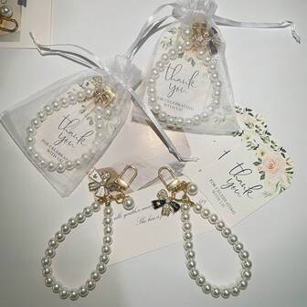 15-delat elegant nyckelringsset med rosett och fuskpärlor, inkluderar nyckelring, tackkort och vit organzapåse, perfekt för brudgåvor, födelsedagspresenter och bröllop