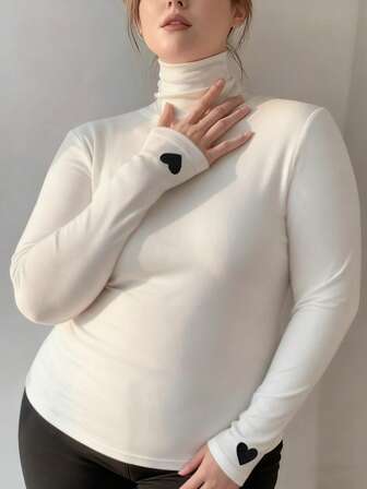 Blusa de cuello alto de manga larga y ajustada con bordado de corazón, para primavera/verano