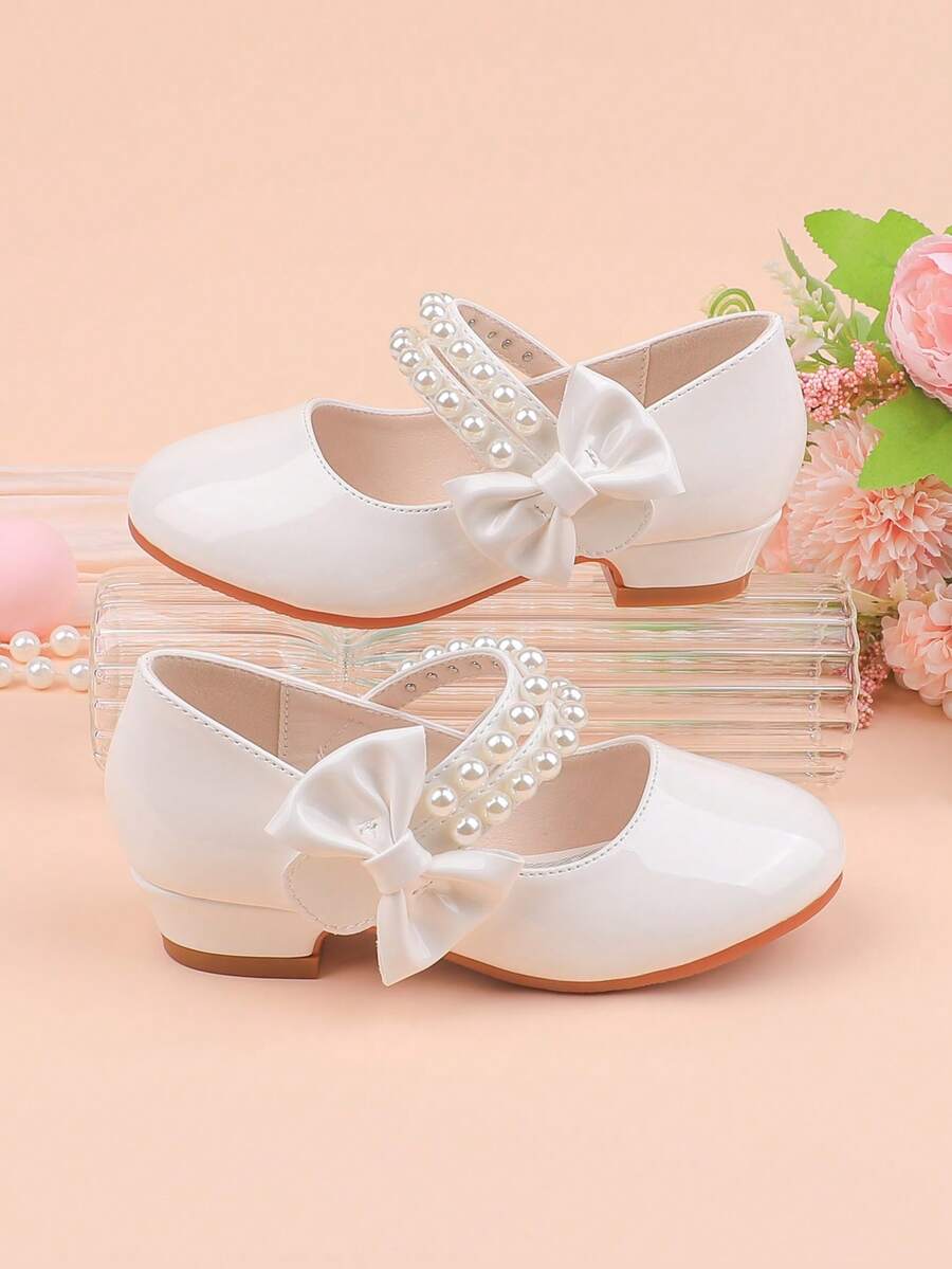 Chaussures de soirée à talon épais avec nœud blanc simple et décoration de perles, convenant aux occasions formelles, aux fêtes, aux mariages, aux représentations, au ballet, au style princesse. Confortables et polyvalentes pour les tout-petites, les petites et les grandes filles. - Blanc - Voir 1