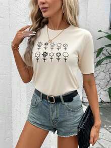 Camiseta informal elegante de poliéster para mujer, de manga corta, cuello redondo, dobladillo regular y detalle de estampado floral. - Albaricoque - Ver 1