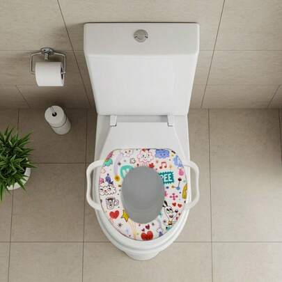 Reductor Infantil para Inodoro con Agarre - Diseño Colorido y Divertido, Este reductor infantil es ideal para ayudar a los más pequeños a familiarizarse con el uso del inodoro de manera cómoda. Cuenta con asas laterales que brindan mayor estabilidad y confianza durante su uso. Está elaborado con materiales suaves y acolchonados para mayor confort, y su tamaño de 35 cm de alto por 30 cm de ancho lo hace compatible con la mayoría de los inodoros estándar. Los diseños se envían al azar, todos con estampados alegres y llenos de color que encantan a los niños.