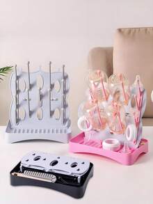 1 Escurridor multifuncional desmontable Material: PP Ligero y portátil Escurridor de tazas Utilizado para escurrir botellas/tazas/platos/vajilla y palillos, etc. Adecuado para el hogar/cocina/baño/habitación del bebé/oficina Estilo moderno y sencillo Diseño de base desmontable Incluye un cepillo desmontable para botellas Fácil de limpiar Fácil de almacenar Incluye ganchos y bandeja También se puede usar como tablero de almacenamiento de escritorio