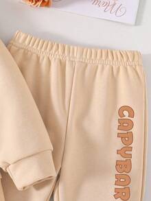 Tween Girl 水豚印花圆领运动衫和喇叭裤套装