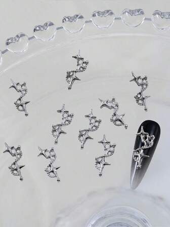 Alloy Nail Art Accessories 10/50 Pieces Simple And Cute Versatile Y2K Style Silver Sparkling Star Nail Decorations Beauty Decorations DIY Nail Accessories For Professional Nail Salons Each Piece Shines With A Delicate Silver Luster, Adorned With Countless Small And Exquisite Star Patterns. Under Light Illumination, They Appear As Brilliant As Stars In The Night Sky, Exuding Y2K Retro Fashion Vibes.