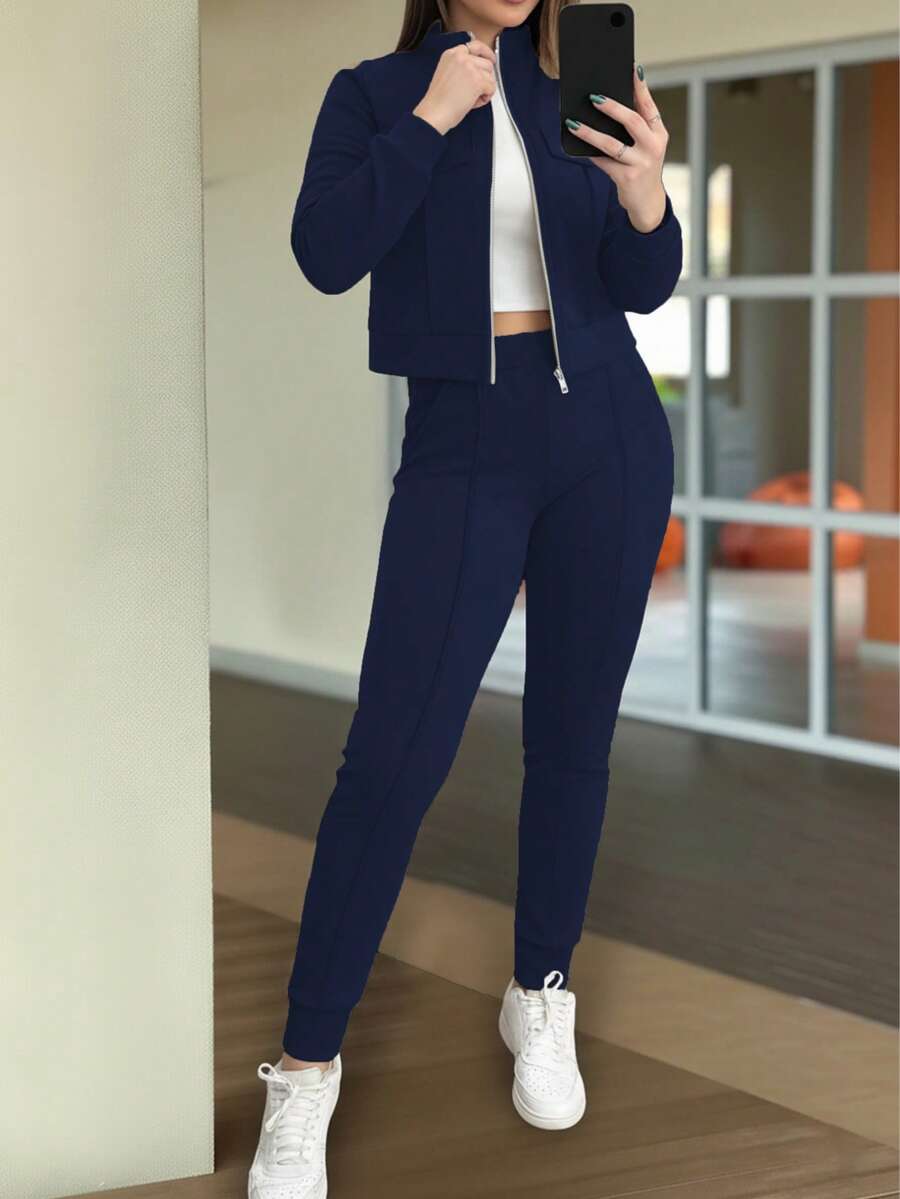 两件套女士休闲纯色套装,拉链短款外套上衣搭配松紧腰带口袋修身裤,适合春、秋、冬季穿着,优雅时尚。 - 藏青色 - 查看 1