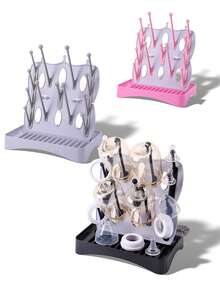 1 Escurridor multifuncional desmontable Material: PP Ligero y portátil Escurridor de tazas Utilizado para escurrir botellas/tazas/platos/vajilla y palillos, etc. Adecuado para el hogar/cocina/baño/habitación del bebé/oficina Estilo moderno y sencillo Diseño de base desmontable Incluye un cepillo desmontable para botellas Fácil de limpiar Fácil de almacenar Incluye ganchos y bandeja También se puede usar como tablero de almacenamiento de escritorio