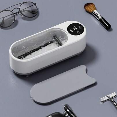 1个便携式超声波珠宝清洗机，用于清洗珠宝，也适用于眼镜、戒指、表带、保持器、假牙、硬币、剃须刀、银器等。