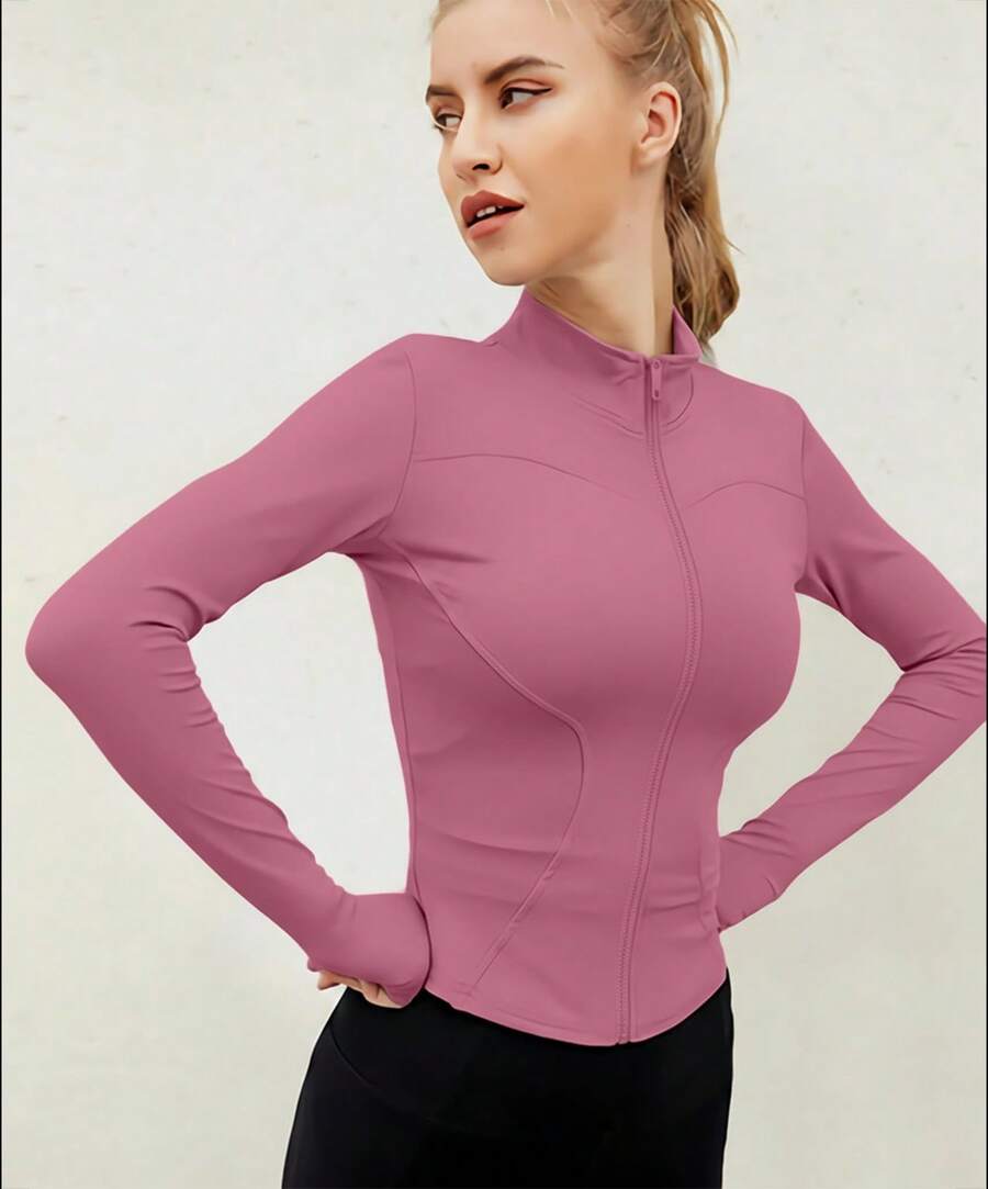 Chaqueta deportiva de manga larga con cremallera de color liso para mujer, corte ajustado y puños con abertura para el pulgar, ideal para fitness, yoga y running. - Palo de rosa - Ver 1