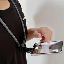 Soporte de correa para el cuello de la cámara, que puede cambiar entre la toma horizontal y vertical de la cámara en un segundo. Es un soporte de cámara giratorio con rosca con un diseño universal para usar en el cuello, hecho de gel de sílice y materiales metálicos flexibles.