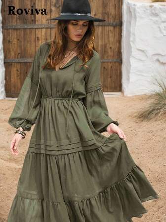 Sukienka Roviva w kolorze oliwkowo-zielonym z dekoltem w serek i marszczeniem w talii, lekka tkanina, wielowarstwowa spódnica, luźne rękawy typu lampion dla swobodnego stylu vintage, odpowiednia do noszenia na co dzień, na wakacje, w podróż, na pustynię, na zewnątrz z kapeluszem, krój podkreślający talię, uniwersalna sukienka na wiosnę/lato
