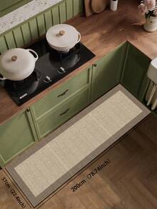 1块硅胶厨房垫，简约双色拼布图案。垫子主体为浅米色，纹理细密，类似编织，边缘为深棕色，形成清晰的区域划分。整体设计简洁大方。厨房垫风格奢华时尚，具有缓冲抗疲劳功能，表面为织物，中间为海绵吸水材质。