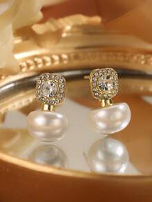 一雙鑲有水鑽和假珍珠的小巧耳釘
