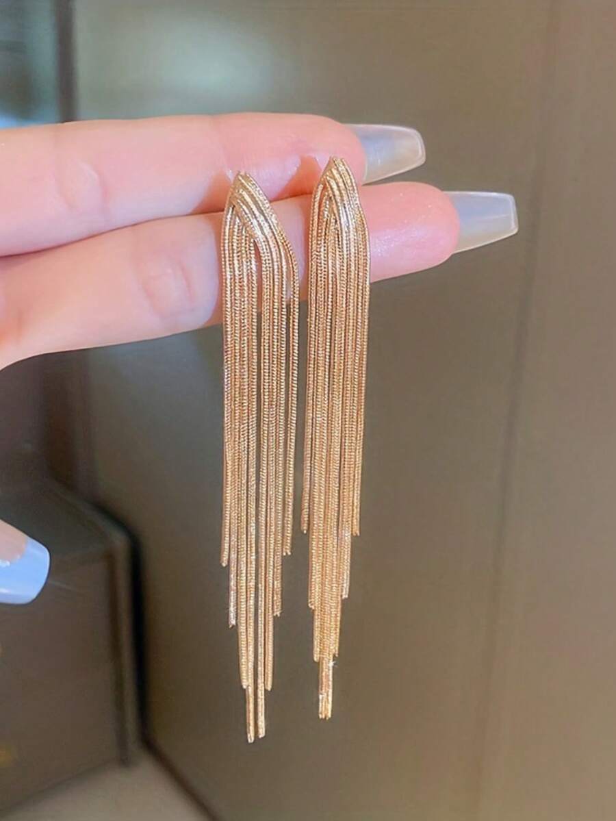 1 par de pendientes largos colgantes de metal con borlas y diseño de hueso de serpiente, de estilo simple y creativo para mujeres