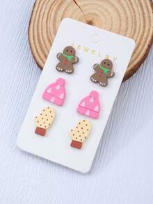 Un set di tre paia di orecchini in acrilico e finta argilla polimerica a tema invernale con design di pupazzo di neve e cappello lavorato a maglia, con orecchini a perno a forma di fiocco di neve - accessori perfetti come regalo per feste natalizie