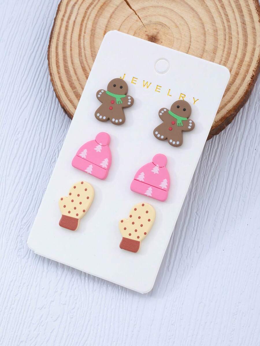 Un set di tre paia di orecchini in acrilico e finta argilla polimerica a tema invernale con design di pupazzo di neve e cappello lavorato a maglia, con orecchini a perno a forma di fiocco di neve - accessori perfetti come regalo per feste natalizie
