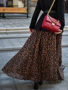 Look Polly Jupe élégante décontractée à taille haute léopard pour femmes en automne-hiver. Style de vacances à la plage digne, avec un sens du style de l'argent ancien. Vêtements occidentaux pour femmes pour les invités de mariage. Jupe en forme de parapluie, imprimé guépard, tenue de Thanksgiving pour femmes