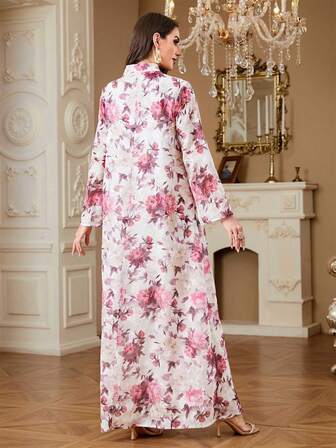 Elegant blommig klänning i vävt tyg med fransar, lämplig för högtider, bröllop, semestrar, alla årstider