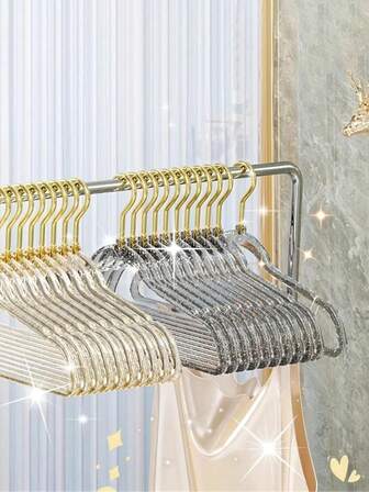 1/5包透明闪亮金色星星衣架。防滑不留痕迹，这些时尚可爱的亚克力水晶衣架是居家和卧室衣物收纳的理想之选。加厚防滑设计使其成为衣柜整理的完美选择。它们可以悬挂裤子、牛仔裤、闪光面料、围巾等，让您的衣柜整洁有序。非常适合秋季衣柜装饰和衣物收纳。