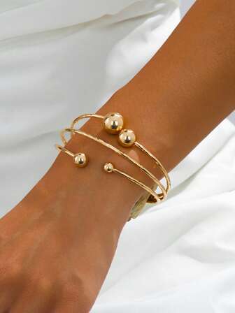 Minimalistiskt geometriskt runt pärl- och linjeöppet armband, lämpligt för både vardagsbruk och present