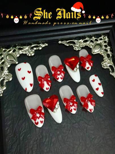 A Series Of Christmas Nails Red Nails Recommended For Christmas Day: DIY 10pcs Of French Y2K Red Nails White Nails Hand Drawn Hearts, Bows, 3D Bow Accessories Decoration, 3D Red Silver Diamonds, Silver Beads White Pearls Medium Long Almond Shaped Pure Handmade Acrylic Press On Nails For The Coming Festivals Like Valentine And Wedding.