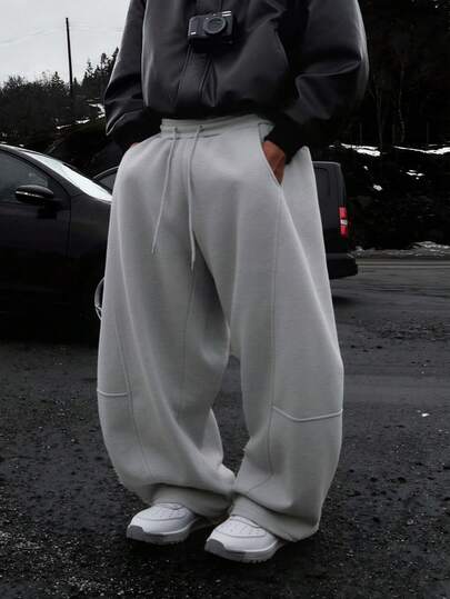 男士纯色休闲宽松运动裤，抽绳松紧腰带，户外简约拼接裤，宽松直筒裤，适合学生和男生穿着。