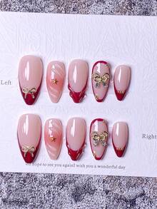 Conjunto com 10 adesivos de unhas postiças prensadas à mão, incluindo unhas curtas, unhas falsas, francesinhas, unhas amendoadas, unhas brancas, vermelhas, rosas, azuis, douradas, olho de gato, unhas fofas, unhas para o Dia dos Namorados e unhas para o Ano Novo. Decoradas com laço dourado e enfeites de floco de neve na superfície. Acompanha kit de aplicação, fácil de colocar e remover. Ideal para mulheres e meninas que gostam de unhas amendoadas. - Vermelho - Ver 1