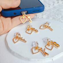 A Minimalist Golden Charm Phone Dust Plug Featuring The 26 Letters Of The Alphabet And A Heart Shape - A-Z Letter Pendant Stylish Heart-Shaped Charging Port Dust Cover, Compatible With Iphone/Type-C Interface, Perfect For Birthday And Holiday Gifts. - Multicolor - View 5