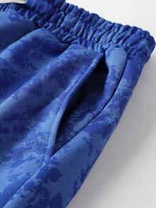 男士轻薄扎染水洗连帽卫衣和抽绳运动裤两件套，老鹰印花图案，连帽卫衣带抽绳和口袋，运动裤腰部也带抽绳，适合春、秋、冬三季街头穿搭、慢跑、通勤、旅行、户外活动，是送给丈夫或男友的理想礼物。 - 彩色 - 查看 9