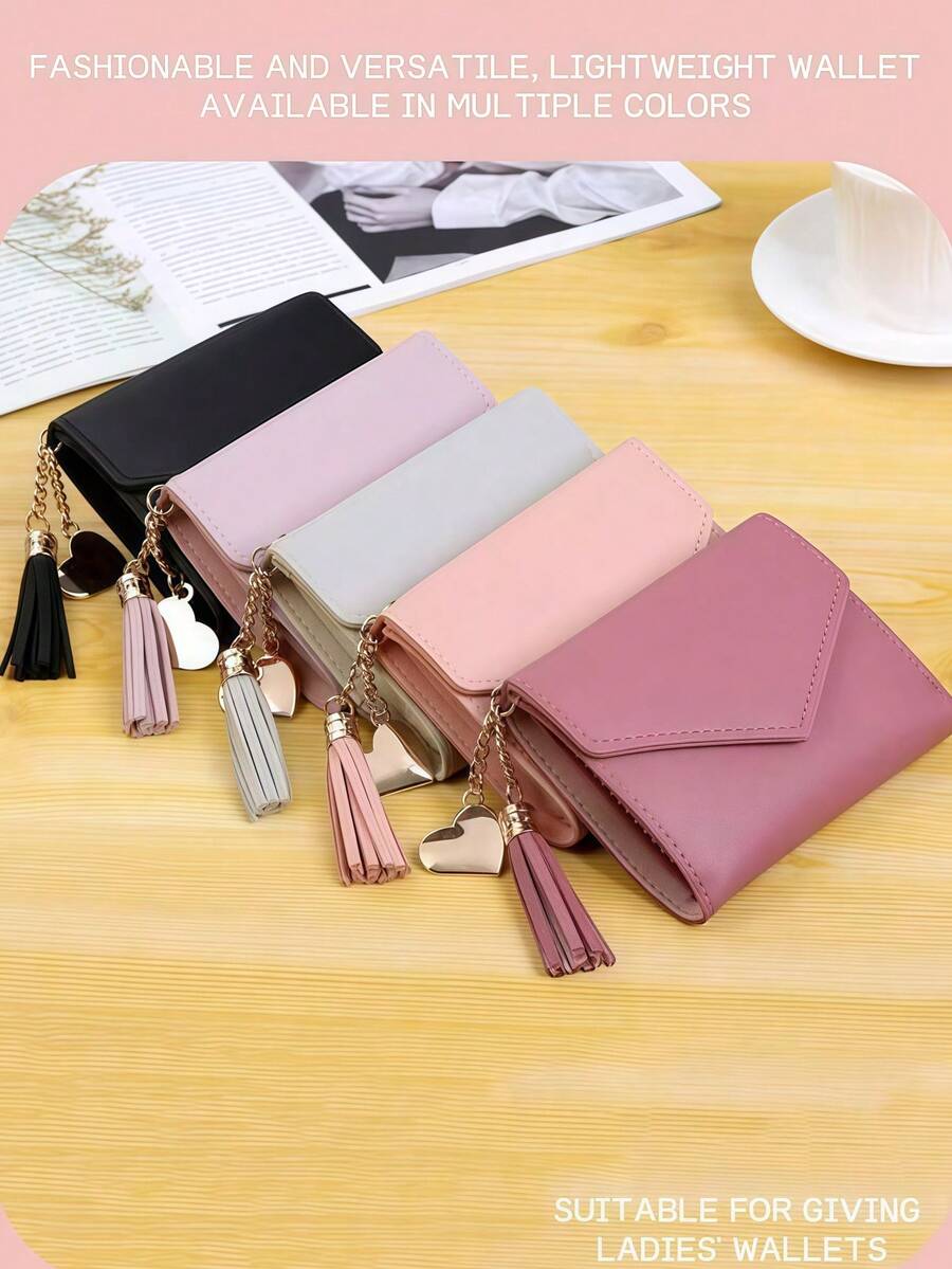 这款可爱的流苏装饰钱包采用人造皮革制成，具有多功能设计，包括女士短款钱包、零钱包、翻盖卡包和信封式布局，使其成为情人节和圣诞节的完美理想礼物。 - 彩色 - 查看 1