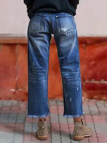 Jeans rectos con ajuste holgado y cómodo, desgastados y lavados en azul, con dobladillo deshilachado, estilo callejero europeo y americano para mujeres