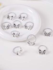 Bộ 10 chiếc dây buộc tóc nơ nhỏ, màu bạc sáng bóng, thiết kế đơn giản, phù hợp cho bé gái và phụ nữ có tóc mỏng, kiểu dáng công chúa dễ thương, đa năng dùng hàng ngày. - Nhiều màu - Xem 6