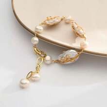 A Delicate And Elegant Twisted Asymmetrical Baroque Shaped Faux Pearl Women's Bracelet