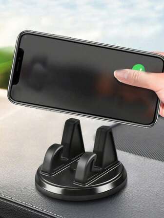 黑色多功能圆盘形车载手机支架，360°旋转，配备耐用粘胶导航支架，解放双手，方便使用GPS和智能手机。防滑圆盘设计，单手操作稳定，广泛兼容安卓和GPS导航设备，是日常通勤、公路旅行和停车辅助的理想之选。安装牢固，易于安装，采用仪表盘友好型粘胶，方便线缆管理。