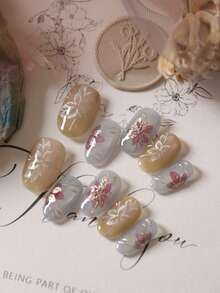 10片装亚克力美甲贴片，蓝色猫眼、棕色、金色花朵、白色、紫色，短款，包含1张粘性贴片和1个迷你指甲锉。 - 彩色 - 查看 1