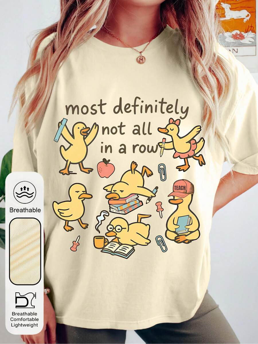 Trenfashion Women's Oversized Short Sleeve Graphic Tee With 'Most Definitely Not All In A Row' Funny Duck Doodle Print, Teacher Life Humorous Casual T-Shirt For Women Women's Cute Duck And "Row Of Ducks" Slogan T-Shirt - Yellow Short Sleeve Round Neck Top With Themed Duck (Books, Pencils, Apples) - Breathable Summer Spring Casual Wear, Suitable For Teachers, Events, And Daily Wear Unisex Plus Size T Shirts - Màu be - Xem 1