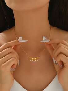 1件18K镀金铜V形单排流苏吊坠项链，镶嵌人造锆石，异域风情，时尚优雅，适合女性日常及派对佩戴，可作为送给女友的礼物，亦可作为社交礼品。 - 金色 - 查看 8