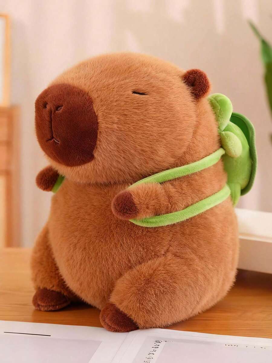 CcRetro Peluche Capibara con Mochila de Tortuga  25CM - Juguete Kawaii Suave y Esponjoso - Regalo Perfecto para Cumpleaños, Navidad, Halloween y Pascua - Almohada Abrazable para Niños y Niñas - Marrón - Ver 1