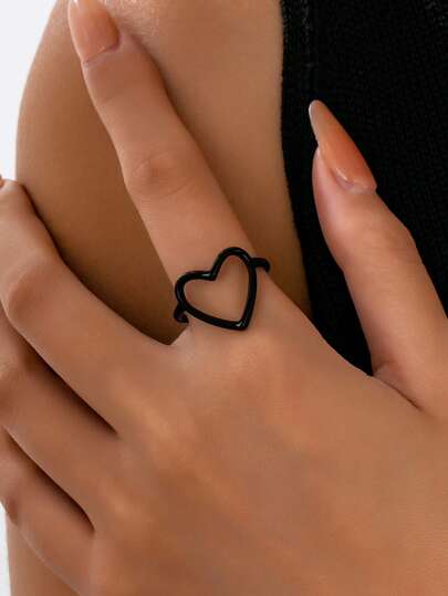 1 pieza Anillo de corazón con línea hueca elegante, color negro minimalista, accesorio versátil adecuado para uso diario, fiestas y como regalo para mujeres