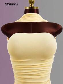 Đầm nữ màu vàng, dây mảnh, hở lưng, dài ngang gối, kiểu dáng gợi cảm và thanh lịch, thích hợp cho các bữa tiệc mùa xuân/hè, đám cưới, lễ hội âm nhạc và các dịp trang trọng. - Màu Mù tạt vàng - Xem 10