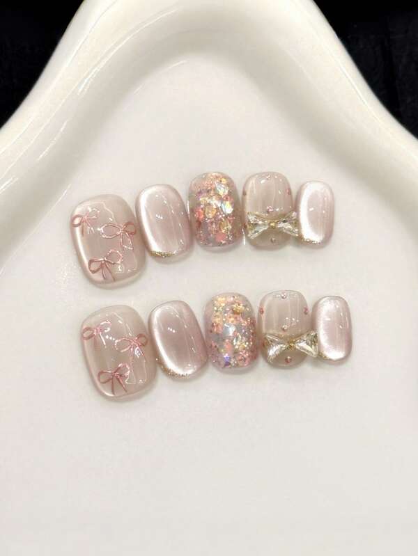 10 piezas de uñas acrílicas postizas hechas a mano, de color rosa suave, con efecto de ojo de gato brillante, decoradas con purpurina, lazos 3D y diamantes, en un estilo minimalista, elegante y sencillo, adecuadas para el otoño, la Navidad, fiestas, uso diario y citas, así como para vacaciones en la playa y el trópico. Adecuadas como regalo y suministros de arte de uñas para mujeres y niñas.