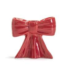 1 peça. O novo castiçal com laço é um clássico suporte de cerâmica para velas aromáticas com listras pretas e brancas, com um toque feminino. É um item decorativo para a sala de estar e sala de jantar.