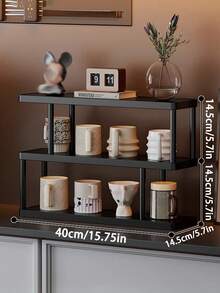 Modern Black Three-Tier Storage Rack, Multi-Level Shelving - Freestanding Tiered Shelf Unit, Black Frame, Ideal For Kitchen, Bathroom, Bedroom - Space-Saving Home Decor Storage Rack, Minimalist Design, Durable And Easy To Clean, Multifunctional Compact Storage Solution Combining Aesthetics And Utility. Ideal For Displaying Books, Cups, And Small Items.