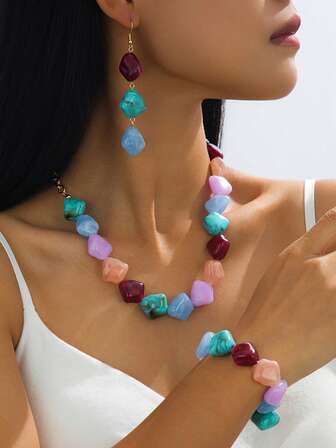 3-delat set med minimalistiska örhängen och halsband i pärla med femuddiga stjärnor