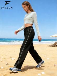 女士黑色侧条纹直筒运动裤，舒适面料，适合户外散步、徒步旅行和日常穿着